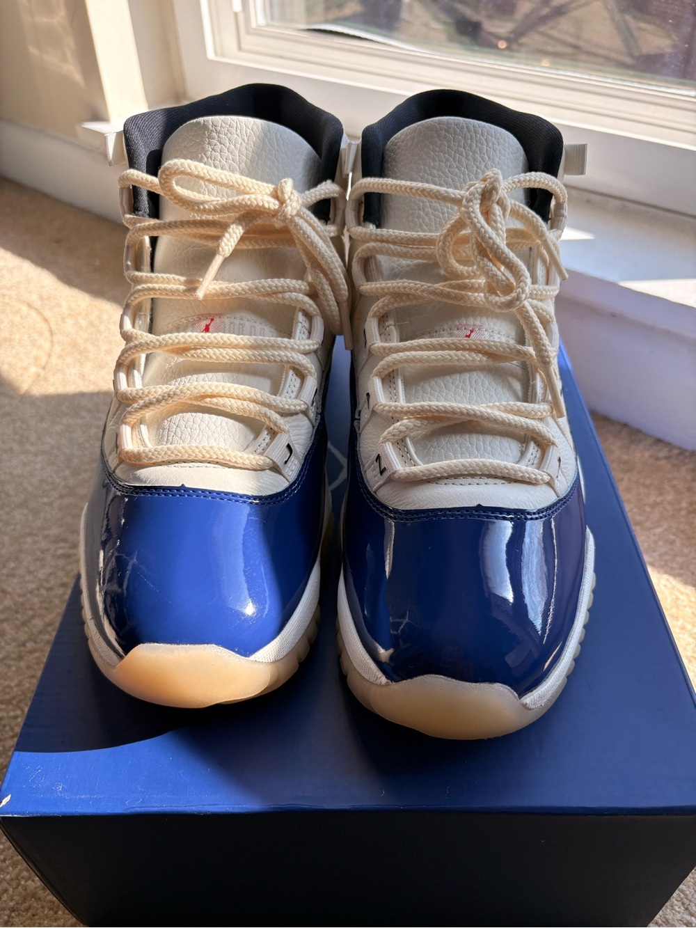 Jordan Retro 11 Patent Leather High-Top Sneakers in White, Royal Blue and Cream